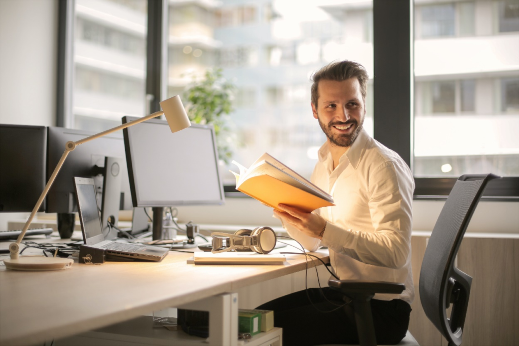 A man sitting and working on a computer